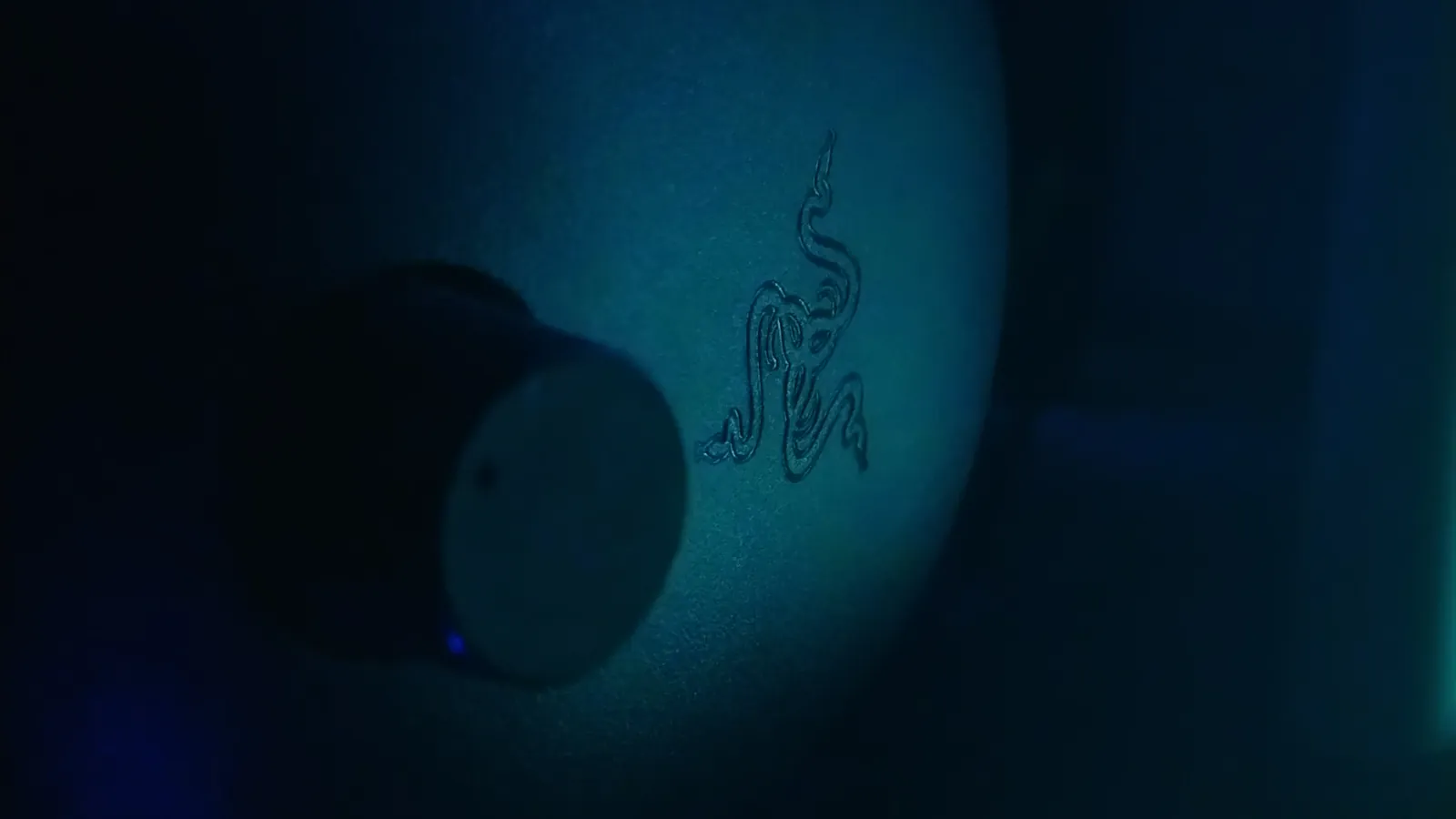 RGB gaming headset on desk with ambient lighting